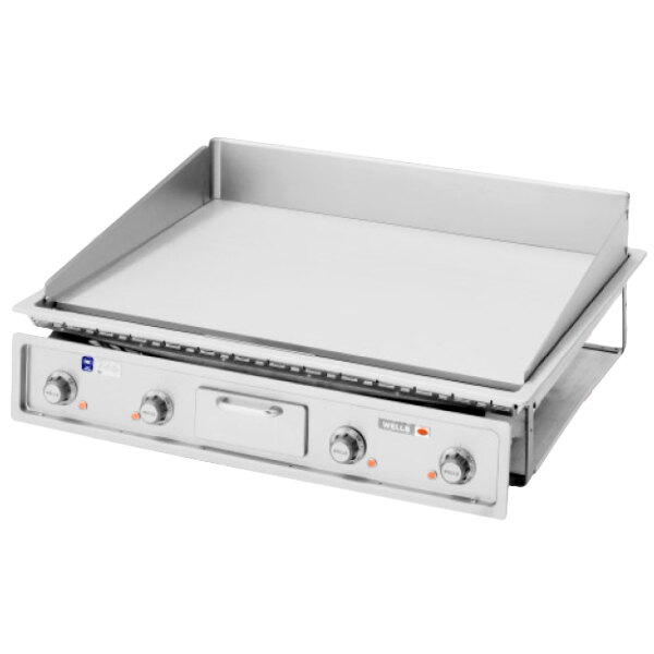 A Wells drop-in countertop electric griddle with two burners.
