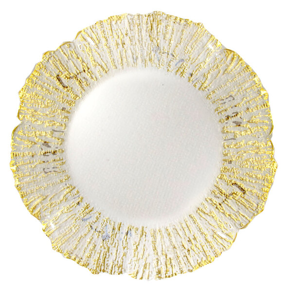 A white glass charger plate with a gold flower design and gold rim.
