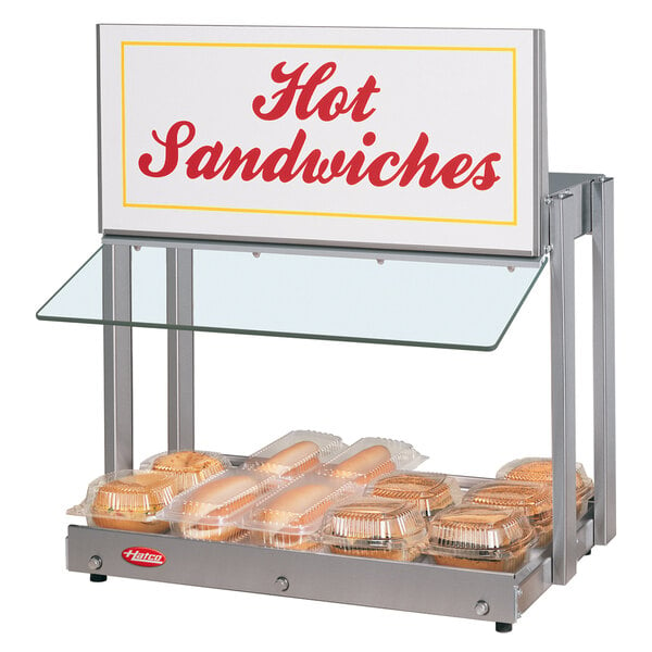 A Hatco countertop hot sandwich display warmer with a sign that says "Hot Sandwiches".