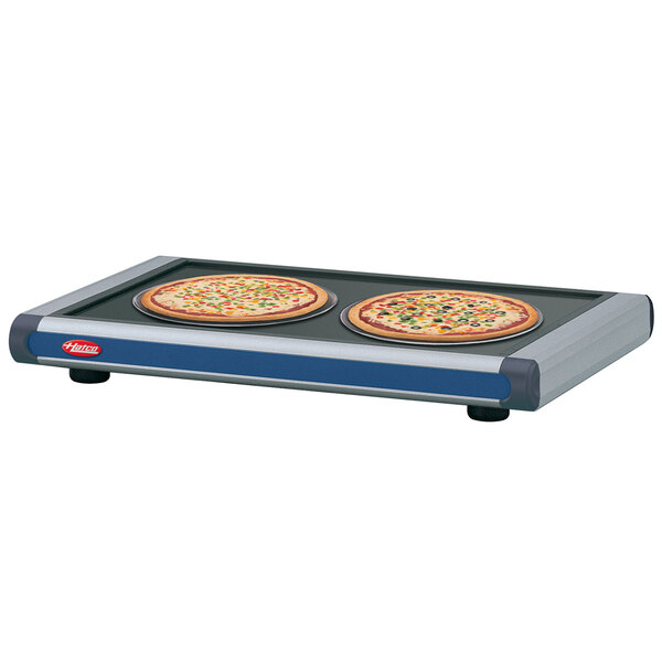 A navy blue Hatco heated shelf with pizzas on it.