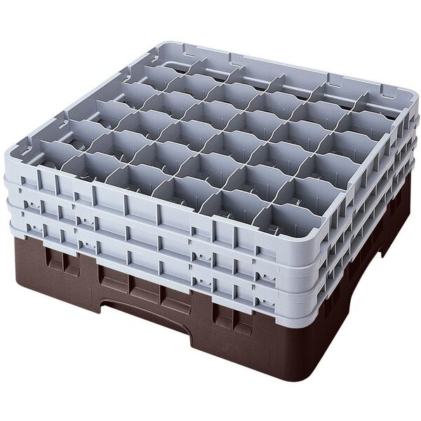 A brown plastic Cambro glass rack with compartments and an extender.