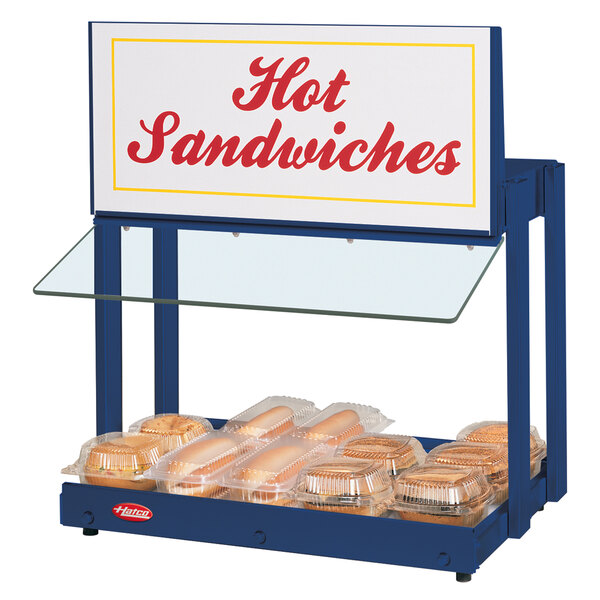 A navy blue Hatco countertop warmer with hot sandwiches and a sign.