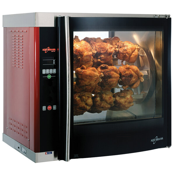 An Alto-Shaam rotisserie oven with 7 cooked chickens on spits.