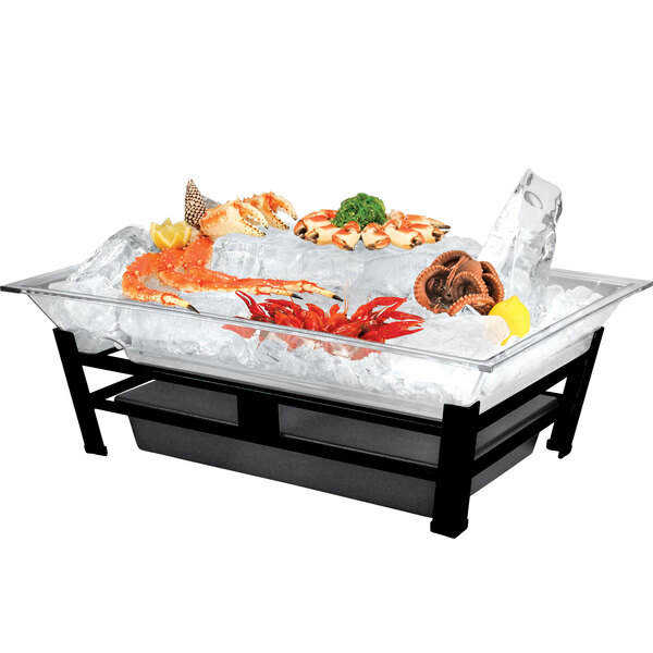 A large rectangular Cal-Mil ice housing system filled with seafood on a table outdoors.