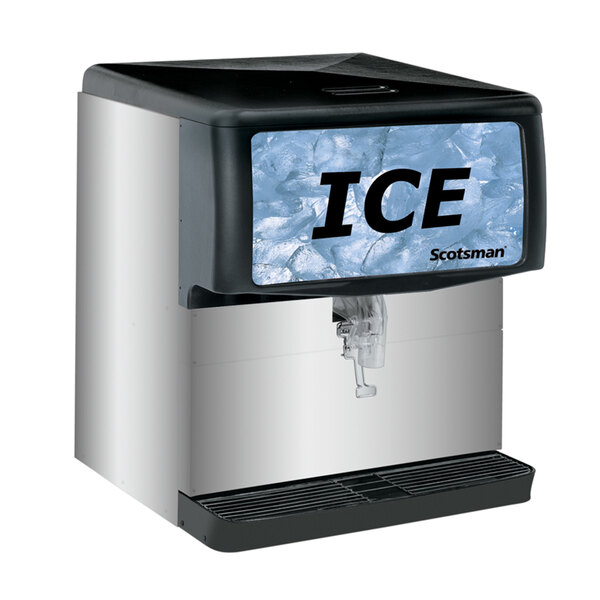 A black Scotsman countertop ice dispenser with a sign on it.