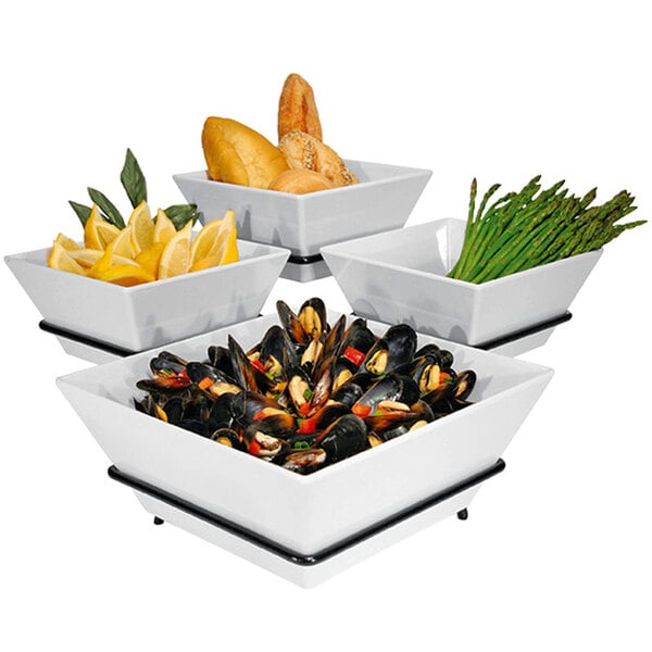 A Cal-Mil black organizer display with white square bowls of food on it.