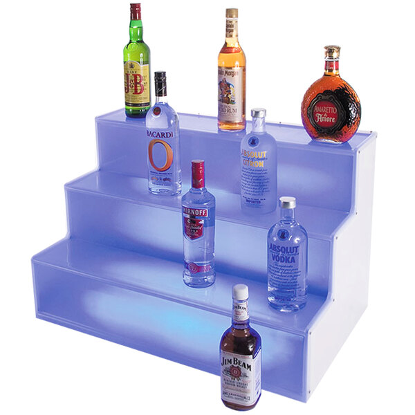A Cal-Mil bottle display with bottles of alcohol on it.