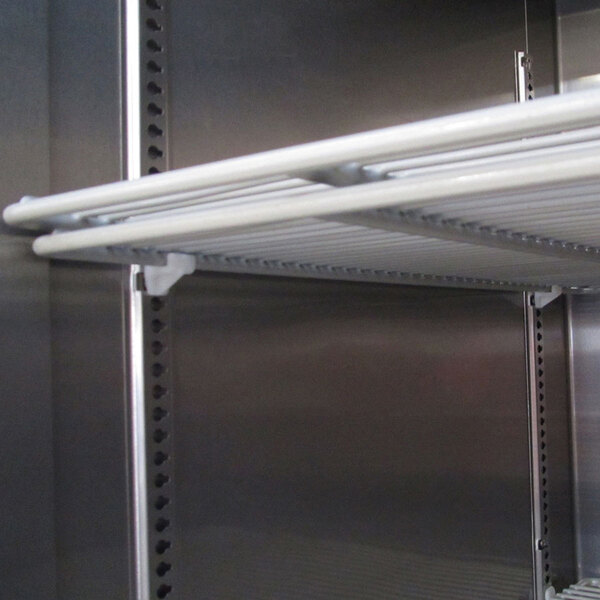 A Turbo Air wire shelf with white metal rods.