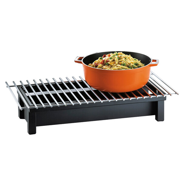 A Cal-Mil black chafer griddle with food in a bowl on a table.