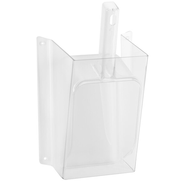 A clear plastic wall mount scoop holder with a scoop inside.