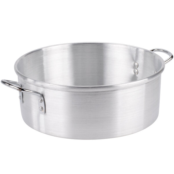 A silver aluminum Town water pan for steaming with handles.