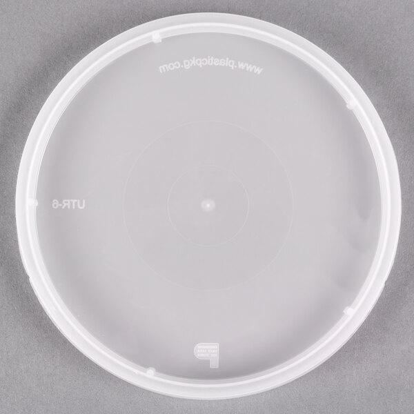 A translucent plastic lid with a tamper evident circle in the center.