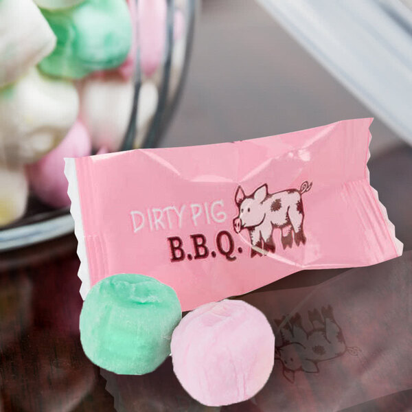 A pink packet of customizable assorted pastel buttermints with a pig on it.