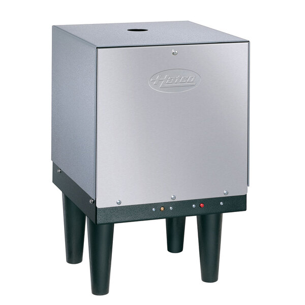 A silver Hatco Mini-Compact electric water heater with black legs and buttons.