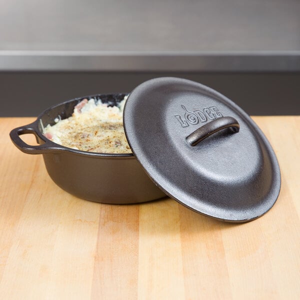 A Lodge cast iron Dutch oven with food inside.