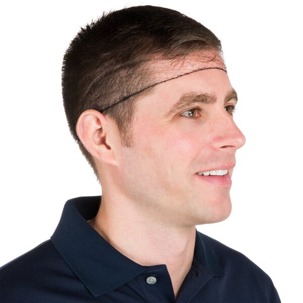 A man wearing a Chef Revival black nylon hairnet with a thin line on his head.