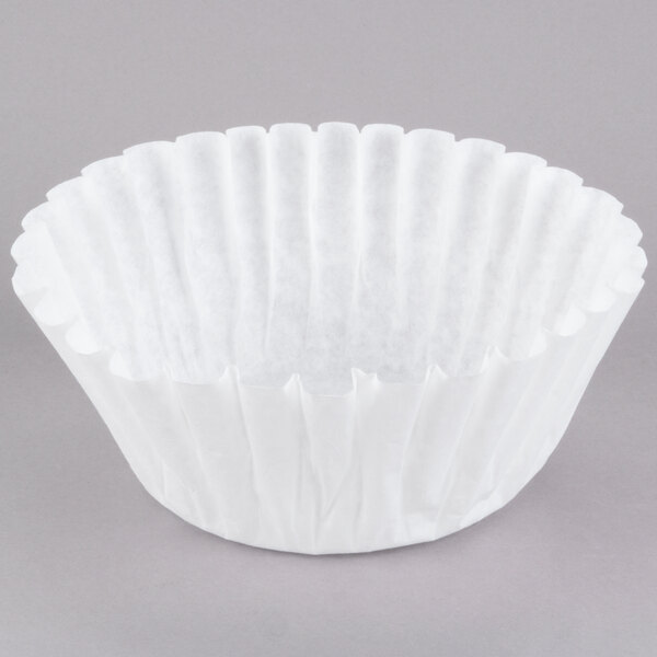 A close-up of a white Grindmaster coffee filter.