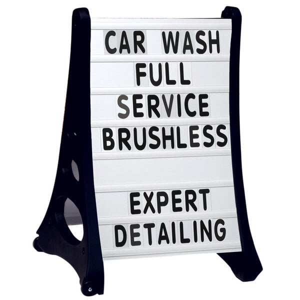 A white Aarco A-Frame sign with black text that says "Car Wash Full Service Brushless Detailing Expert"