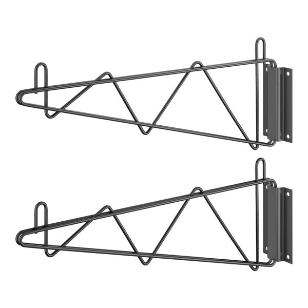 A pair of black metal Regency wall mounting brackets with hooks on them.