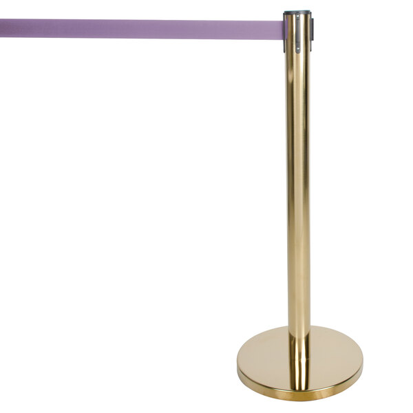 A gold pole with a long purple retractable tape on a gold base.