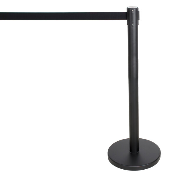 A black Aarco crowd control stanchion with a black retractable belt on a round base.