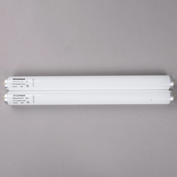 A white rectangular package with two white fluorescent tubes inside.