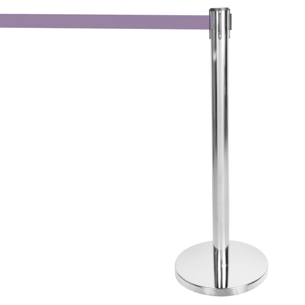 A silver metal Aarco crowd control stanchion with purple tape.