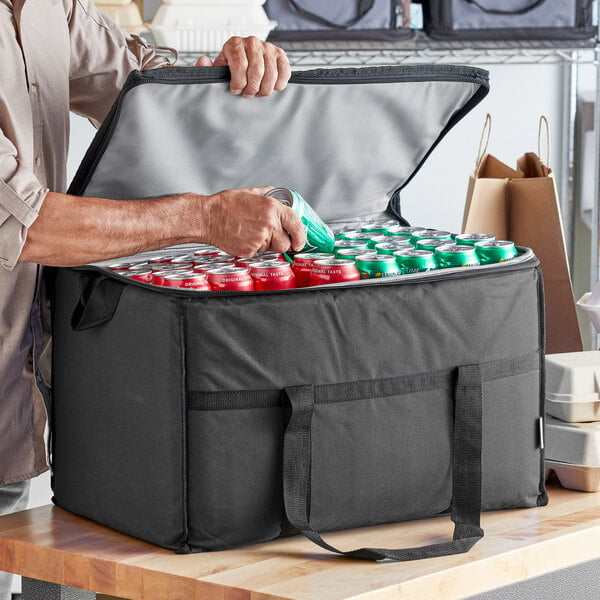A man opening a Choice large insulated cooler bag full of cans.