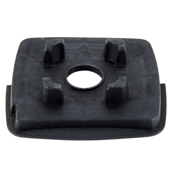 A black rubber square with a hole in the middle.