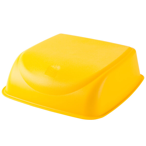 A yellow plastic Koala Kare cinema booster seat with a logo on it.