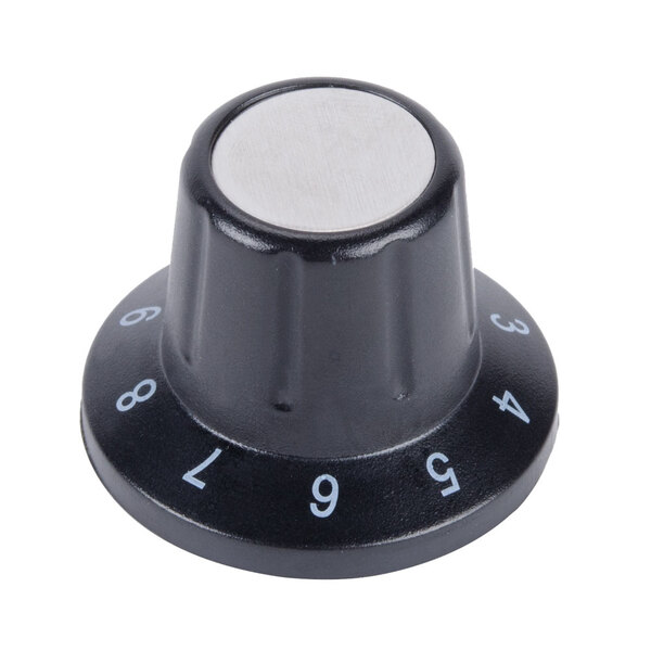 A black and silver knob with white numbers.
