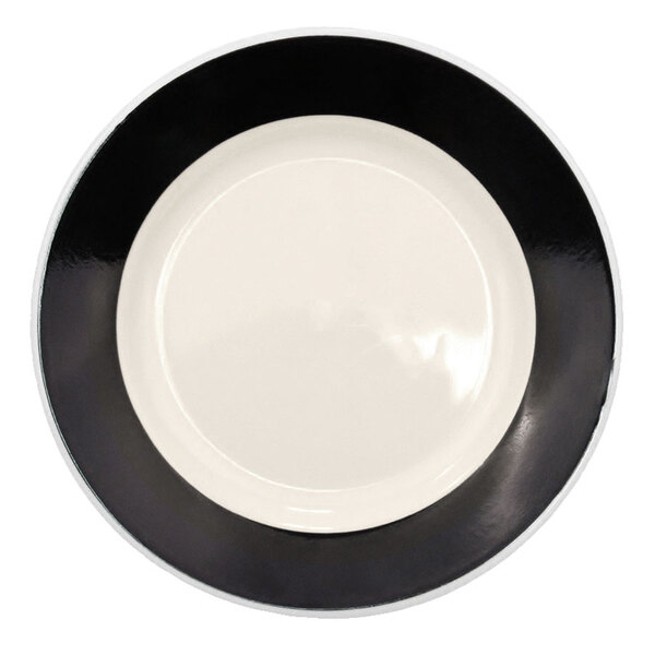 A black CAC Rainbow china plate with a white rim.