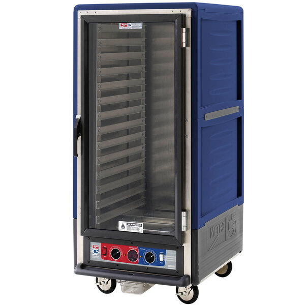 A blue Metro C5 heated holding and proofing cabinet with clear door on a silver cart.
