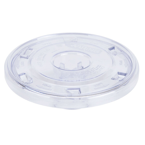 A clear plastic lid with a circular hole on a white background.