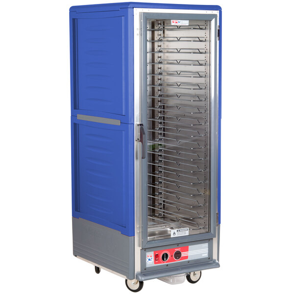 A blue Metro C5 hot holding cabinet with clear door on wheels.