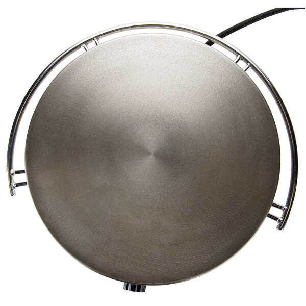 A stainless steel round grill plate with a metal handle.