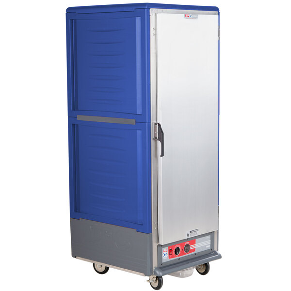 A blue and silver Metro C5 3 Series hot holding cabinet on wheels.
