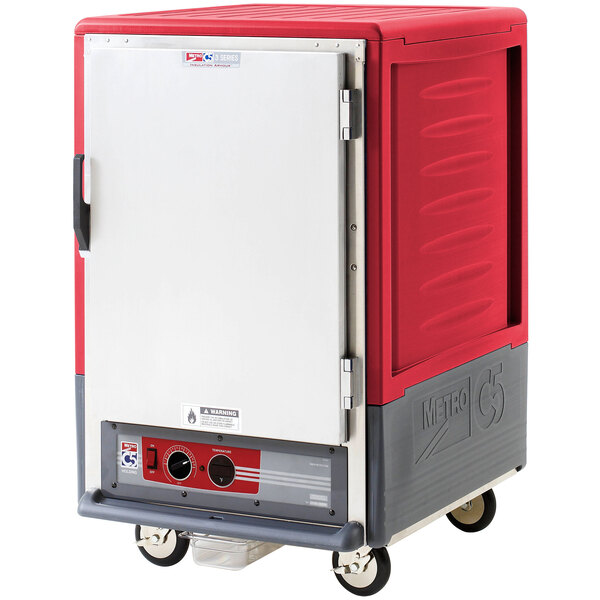 A red and grey rectangular Metro C5 heated holding cabinet with a solid door.