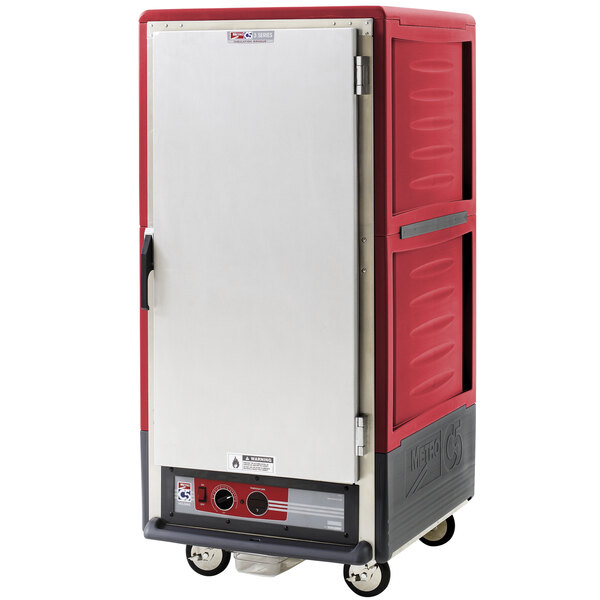 A red commercial Metro heated holding cabinet with a solid door.