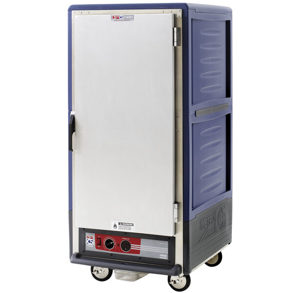 A large blue Metro heated holding cabinet with universal slides and a solid door.