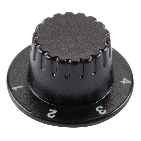 A black plastic cap with white numbers in a circular pattern.