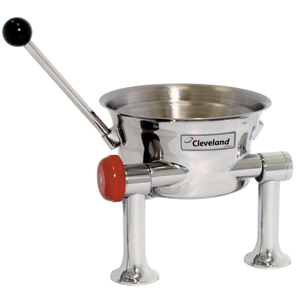 A Cleveland stainless steel tilting steam kettle with a red handle.