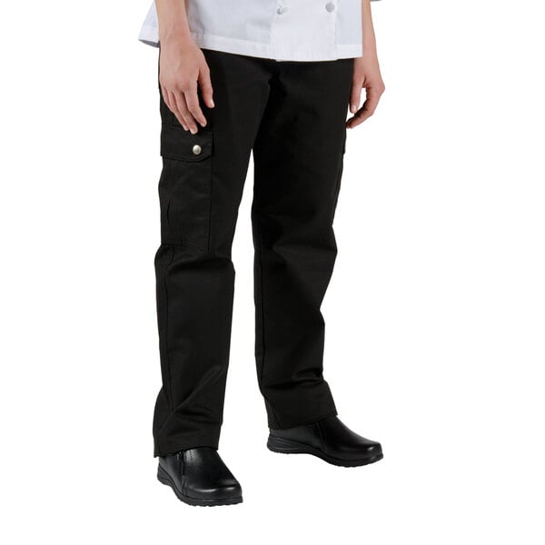 A woman wearing Chef Revival black cargo chef pants and a white shirt.