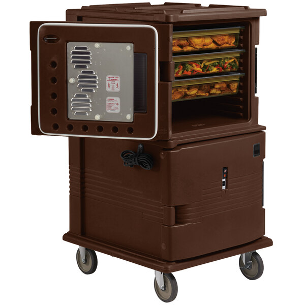 A dark brown Cambro Ultra Camcart holding hot food trays with a door open.