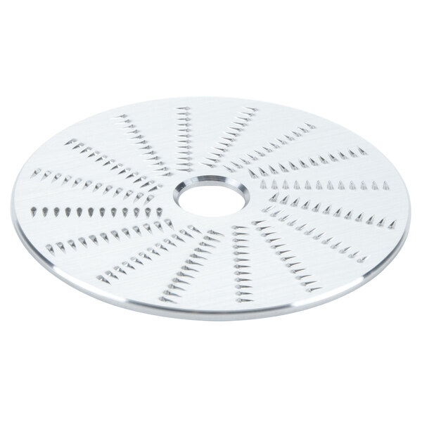 A circular metal Waring shredder plate with holes.