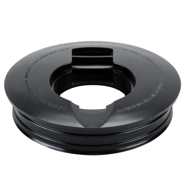 A black round plastic lid with a hole in it.