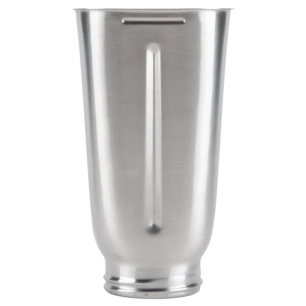 A silver Waring stainless steel blender jar with a handle.