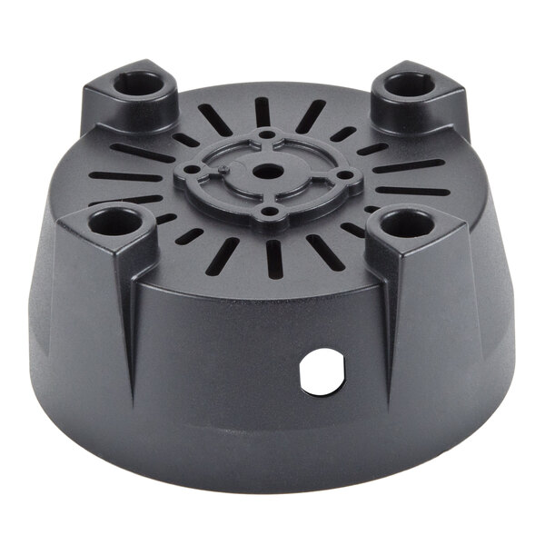 A black plastic circular object with holes.