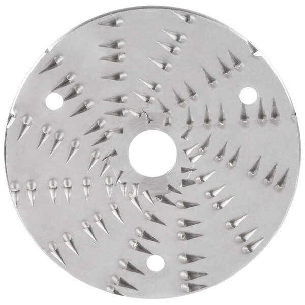 A circular metal Waring shredder disc with spikes on it.