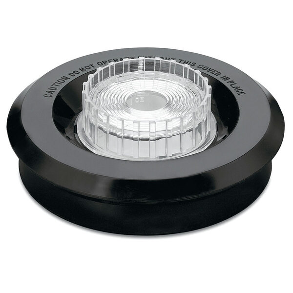 A black circular lid with a clear plastic cover.
